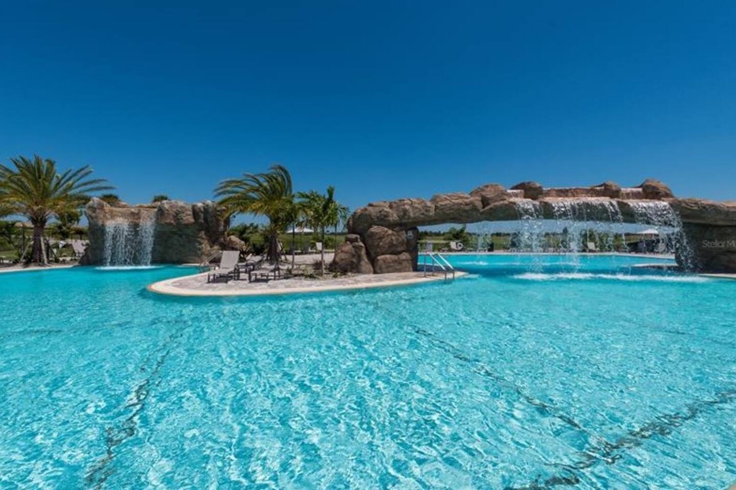 Resort lagoon pool with waterfalls at Lakewood National, Bradenton, FL