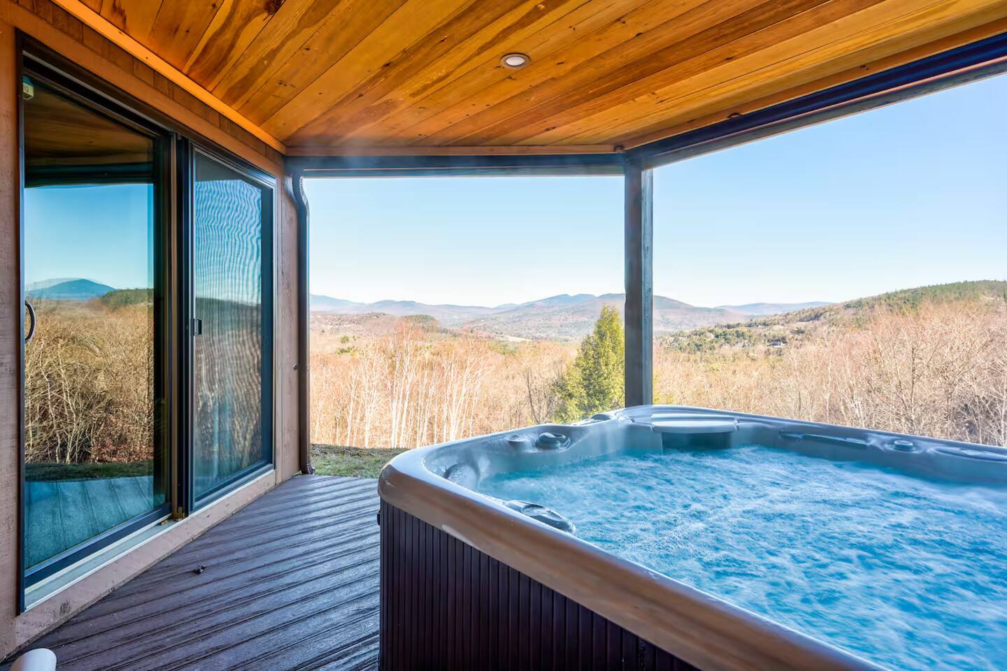 Mountain-view deck and hot tub at a Bartlett, NH retreat